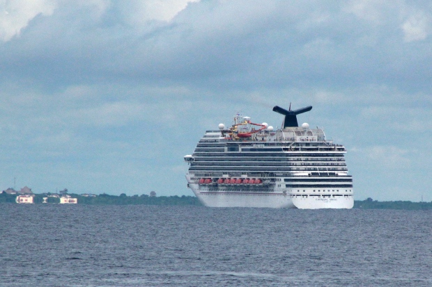 Cruise ship carrying health care worker returns