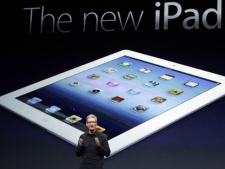 Apple CEO Tim Cook introduces the new iPad during an event in San Francisco, Wednesday, March 7, 2012. (AP Photo/Paul Sakuma)