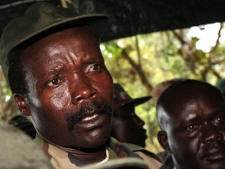 In this Nov. 12, 2006 file pool photo, the leader of the Lord's Resistance Army, Joseph Kony answers journalists' questions following a meeting with UN humanitarian chief Jan Egeland at Ri-Kwamba in southern Sudan. (AP Photo/Stuart Price, Pool, File)