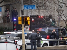 Police gather on DeSoto street near the front entrance to the Western Psychiatric Institute and Clinic on the University of Pittsburgh campus on Thursday, March 8, 2012 in Pittsburgh. There were reports of gunfire at the psychiatric clinic injuring several people, and police were looking for a gunman. (AP Photo/Keith Srakocic)