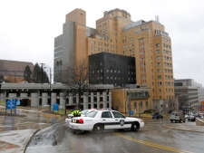 Police block the rear entrance to the Western Psychiatric Institute and Clinic on the University of Pittsburgh campus, Thursday, March 8, 2012 in Pittsburgh. There were reports of gunfire at the psychiatric clinic injuring several people, and police were looking for a gunman. (AP Photo/Keith Srakocic)