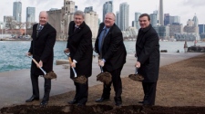 Toronto Port Authority chair Mark McQueen, left to right, Prime Minister Stephen Harper, Toronto Mayor Rob Ford and Finance Minister Jim Flaherty break ground on the construction of a pedestrian tunnel to Billy Bishop airport in Toronto on Friday, March 9, 2012. THE CANADIAN PRESS/Pawel Dwulit