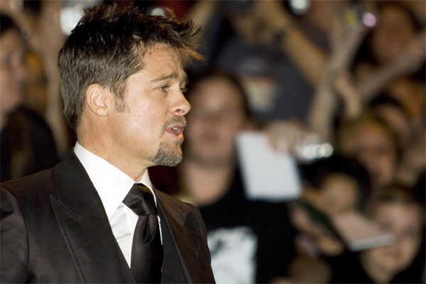 Actor Brad Pitt makes his way on the red carpet as he arrives for the screening of 'Burn After Reading' on Friday, Sept. 5, 2008 in Toronto. THE CANADIAN PRESS / Nathan Denette