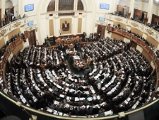 A general view of the Egyptian parliament during a working session in Cairo, Egypt, Sunday, March 11, 2012. Egypt's parliament has called for a vote on stopping U.S. aid. Sunday's move by the People's Assembly was sparked by the March 1 departure of six Americans defendants in a case of 43 employees of nonprofit groups accused of using illegal foreign funds to foment unrest in Egypt. (AP Photo/Mohammed Asad)