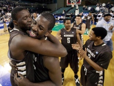 St. Bonaventure players Youssou Ndoye, left, of Senegal, and Andrew Nicholson celebrate after defeating Xavier 67-56 to win the NCAA college basketball championship game in the Atlantic 10 men's tournament in Atlantic City, N.J., Sunday, March 11, 2012. (AP Photo/Mel Evans) 