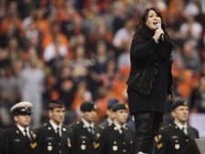Jann Arden performs the national anthem before the CFL's Grey Cup game, between the Winnipeg Blue Bombers and B.C. Lions, on Sunday, Nov. 27, 2011, in Vancouver. (THE CANADIAN PRESS/Darryl Dyck)