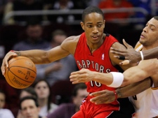 Toronto Raptors' DeMar DeRozan, left, pushes to the key against Cleveland Cavaliers' Anthony Parker in the first quarter of an NBA basketball game in Cleveland on Tuesday, March 13, 2012. (AP Photo/Amy Sancetta)