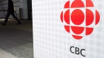 A man leaves the CBC building in Toronto on April 4, 2012. (The Canadian Press/Nathan Denette)