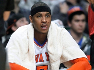 New York Knicks forward Carmelo Anthony sits on the bench during the second half of an NBA basketball game against the Chicago Bulls on Monday, March 12, 2012, in Chicago. The Bulls won 104-99. (AP Photo/Charles Rex Arbogast)
