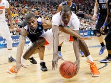 UNC-Asheville's Jaron Lane, left, and Syracuse's Baye Keita, reach for a loose ball in the first half of an East Regional NCAA tournament second-round college basketball game on Thursday, March 15, 2012, in Pittsburgh. (AP Photo/Keith Srakocic)