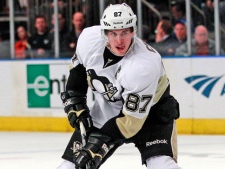 Pittsburgh Penguins' Sidney Crosby (87) looks to pass during the first period of an NHL hockey game against the New York Rangers on Thursday, March 15, 2012, in New York. (AP Photo/Frank Franklin II)