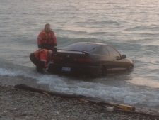 Police are investigating after a car was found submerged in Lake Ontario off Marie Curtis Park on Thursday, March 15, 2012. (CP24/Cam Woolley)