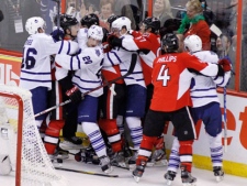 Ottawa Senators players and Toronto Maple Leafs players fight during second period NHL hockey action in Ottawa, Saturday March 17, 2012.THE CANADIAN PRESS/Fred Chartrand