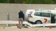 Man arrested after news van crashes gas station