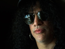 Guitarist Slash poses for a photo in Toronto on Wednesday, March 21, 2012. (THE CANADIAN PRESS/Nathan Denette)