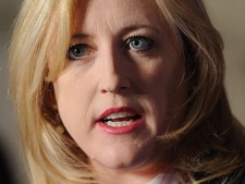 Minister of Labour Lisa Raitt delivesr a statement in the foyer of the House of Commons on Parliament Hill in Ottawa on Tuesday, March 13, 2012. (THE CANADIAN PRESS/Sean Kilpatrick)