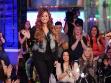 Singer songwriter actress Demi Lovato takes questions from fans following the premiere of MTV's "Demi Lovato: Stay Strong" at the MTV Times Square Studios on March 6, 2012 in New York City. (AP Photo/Scott Gries)