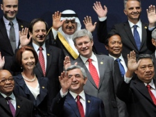 Prime Minister Stephen Harper, middle, takes part in the "family photo" at the Nuclear Security Summit in Seoul, South Korea on Tuesday, March 27, 2012. (THE CANADIAN PRESS/Sean Kilpatrick)