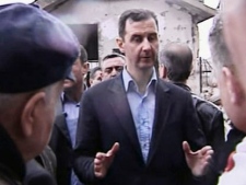 In this image made from video, Syrian President Bashar Assad visits Baba Amr neighborhood in Homs, Syria on Tuesday, March 27, 2012. Assad visited Baba Amr, a former rebel stronghold in the key city of Homs that became a symbol of the uprising, after a month-long siege by government forces killed hundreds of people many of them civilians as troops pushed out rebel fighters. (AP Photo/Syrian State Television via APTN)