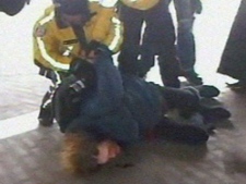 An 'Occupy Toronto' protester is arrested Friday afternoon. (CP24)