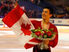 Patrick Chan of Canada, wearing his gold medal holds the Canada flag after the Men Free skating at the ISU 2012 World Figure Skating Championships in Nice, southern France, Saturday, March 31, 2012. (AP Photo/ Francois Mori)