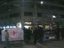 A crowd of protesters with the "Occupy Toronto" movement are seen near University Avenue and Dundas Street Saturday night. (CP24)