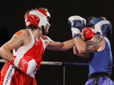 Conservative Senator Patrick Brazeau and Liberal MP Justin Trudeau fight in a charity boxing match for cancer research Saturday, March 31, 2012 in Ottawa. Trudeau stopped Brazeau in the third round. THE CANADIAN PRESS/Fred Chartrand