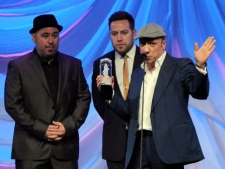 Members of MonkeyJunk receive the Juno for Blues Album of the Year for their album To Behold during the Juno Gala dinner in Ottawa on Saturday, March 31, 2012. THE CANADIAN PRESS/Sean Kilpatrick