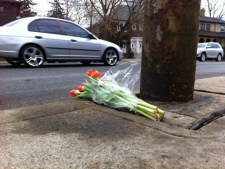 Flowers lay at the scene of a fatal crash that occurred on Mount Pleasant Road at around 2:35 a.m. on Tuesday, April 3, 2012. 