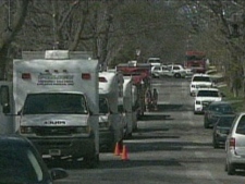 Police vehicles are seen outside the Forest Hill home of Byron Sonne Wednesday. (CP24)