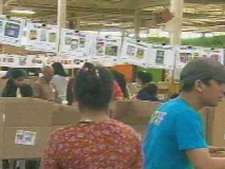 Volunteers with the Daily Bread Food Bank are shown sorting donations on Saturday. (CP24)