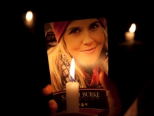 A candle lights up a picture of freestyle skier Sarah Burke during a memorial service for her in Whistler, B.C., on Tuesday, April 10, 2012. Burke, a freestyle skiing pioneer, died Jan. 19, 2012, following an accident during a training session in Utah. (THE CANADIAN PRESS/Jonathan Hayward)