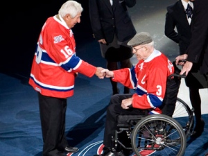 Elmer Lach, left, and Emile "Butch" Bouchard shake hands before dropping the puck for the ceremonial faceoff as the Habs play the Boston Bruins to start their 100th season of NHL hockey action in Montreal Wednesday, Oct. 15, 2008. THE CANADIAN PRESS/Ryan Remiorz