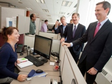 Ontario Premier Dalton McGuinty and Energy Minister Chris Bentley share a laugh with 3M employee Sophie LaRochelle during a tour of the company's revamped offices in London, Ont., on Tuesday, Jan. 31, 2012. (THE CANADIAN PRESS/ Geoff Robins)