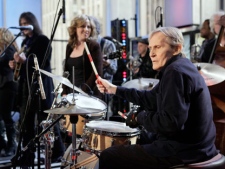 In this Oct. 9, 2009 file photo, Levon Helm, right, performs with his band on the "Imus in the Morning" program on the Fox Business channel, in New York. At center is his daughter Amy Helm. A message posted on Tuesday, April 17, 2012 on the 71-year-old musician's website by his family says "Levon is in the final stages of his battle with cancer." Helm was diagnosed with throat cancer in 1998 and the illness reduced his voice to a whisper. But he still continued to sing on albums and at rollicking concerts at his Woodstock home. Helm was a key member of The Band and lent his distinctive Southern voice to classics like "The Weight" and "The Night They Drove Old Dixie Down." (AP Photo/Richard Drew)