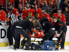 Chicago Blackhawks right wing Marian Hossa is taken off the ice on a stretcher after getting an elbow from Phoenix Coyotes left wing Raffi Torres during Game 3 of the Western Conference quarterfinals at The United Center in Chicago, on Tuesday, April 17, 2012. (AP Photo /Daily Herald, Steve Lundy)