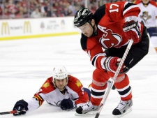 New Jersey Devils' Ilya Kovalchuk (17), of Russia, skates against Florida Panthers' Stephen Weiss during the second period of Game 4 of a first-round NHL hockey Stanley Cup playoff series on Thursday, April 19, 2012, in Newark, N.J. (AP Photo/Julio Cortez)