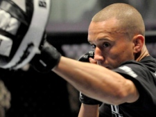 Featherweight Mark (The Machine) Hominick works out in the octagon in Toronto on April 28, 2011. (THE CANADIAN PRESS/J.P. Moczulski)