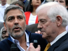 Actor George Clooney, and his father Nick Clooney, take part in a protest at the Sudan Embassy in Washington on Friday, March 16, 2012. The demonstrators are protesting the escalating humanitarian emergency in Sudan that threatens the lives of 500,000 people.
