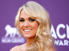 Carrie Underwood arrives at the 47th Annual Academy of Country Music Awards on Sunday, April 1, 2012, in Las Vegas. (AP Photo/Isaac Brekken)