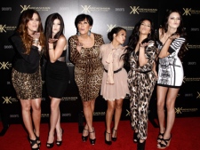 In this Aug. 17, 2011 file photo, from left, Khloe Kardashian, Kylie Jenner, Kris Jenner, Kourtney Kardashian, Kim Kardashian, and Kendall Jenner arrive at the Kardashian Kollection launch party in Los Angeles. The E! Entertainment network said Tuesday it had reached a deal with its most bankable franchise to make three more seasons of "Keeping Up With the Kardashians." (AP Photo/Matt Sayles)