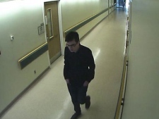Toronto police have released this security camera photo of a suspect wanted in connection with the theft of artworks from the Hospital for Sick Children on Thursday, April 19, 2012.