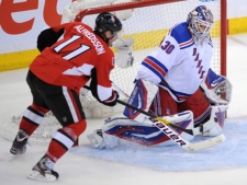 Ottawa Senators forward Daniel Alfredsson attempts a shot on New York Rangers goaltender Henrik Lundqvist during the second period of Game 6 of a first-round NHL playoff series at Scotiabank Place in Ottawa on Monday, April 23, 2012. (THE CANADIAN PRESS/Sean Kilpatrick)