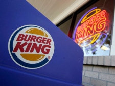 This Aug. 23, 2010 file photo shows company logos on display at a Burger King restaurant in Mountain View, Calif. (AP Photo/Paul Sakuma, File)