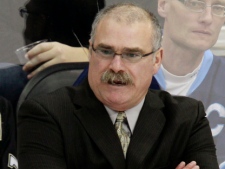 Ottawa Senators head coach Paul MacLean stands behind the bench during the first period of an NHL game against the Pittsburgh Penguins on Friday, Nov. 25, 2011, in Pittsburgh. (AP Photo/Gene J. Puskar)