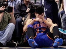 In this March 6, 2012, file photo, New York Knicks' Jeremy Lin reacts after being fouled during an NBA basketball game against the Dallas Mavericks in Dallas. Lin is having left knee surgery and will miss six weeks, likely ending his amazing breakthrough season. (AP Photo/Tony Gutierrez)