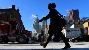 A woman walks in downtown Toronto on Jan. 7, 2015. (Frank Gunn / The Canadian Press)