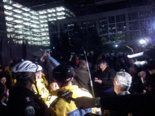 Demonstrators attempt to set up a tent in Simcoe Park shortly before midnight on Tuesday, May 1, 2012. 