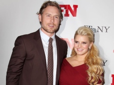In this Nov. 29, 2011, file photo, singer Jessica Simpson poses with fiance Eric Johnson at the 25th Annual Footwear News Achievement Awards at The Museum of Modern Art in New York. A publicist for the singer confirmed Simpson gave birth to a daughter named Maxwell Drew Johnson in Los Angeles on Tuesday, May 1, 2012. (AP Photo/Starpix, Amanda Schwab, file)