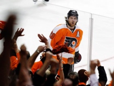 Philadelphia Flyers center Claude Giroux (28) reacts after his goal in the third period of Game 1 in a second-round NHL Stanley Cup hockey playoff series with the New Jersey Devils on Sunday, April 29, 2012, in Philadelphia. The Flyers won 4-3 in overtime. (AP Photo/Alex Brandon)